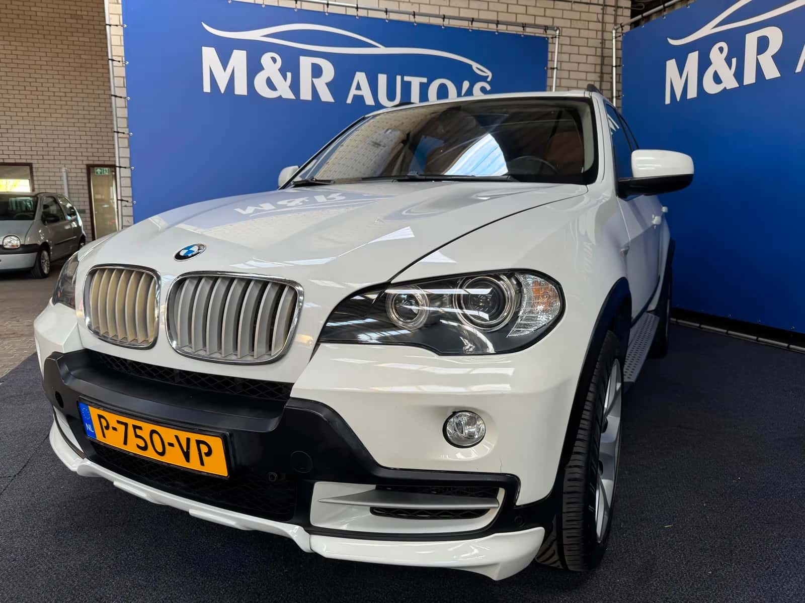 BMW X5 (2009) — foto 1