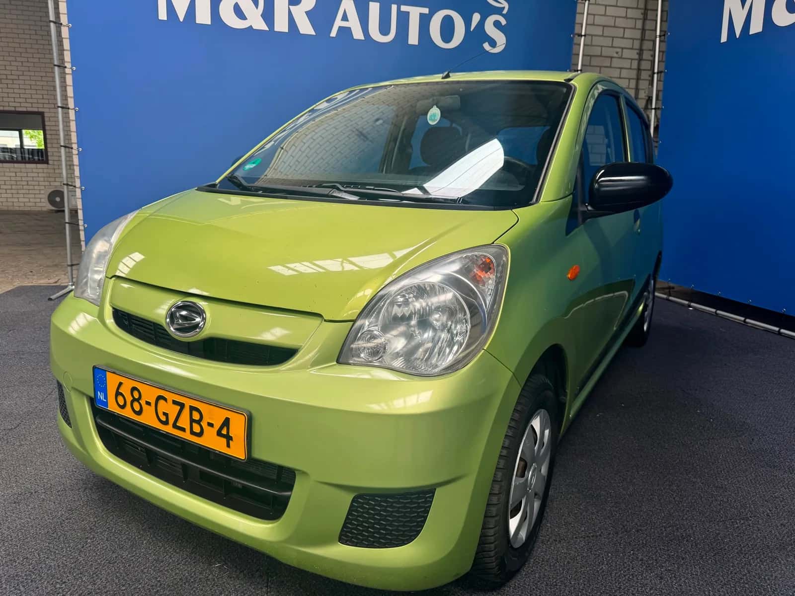 Daihatsu Cuore (2008) — foto 1