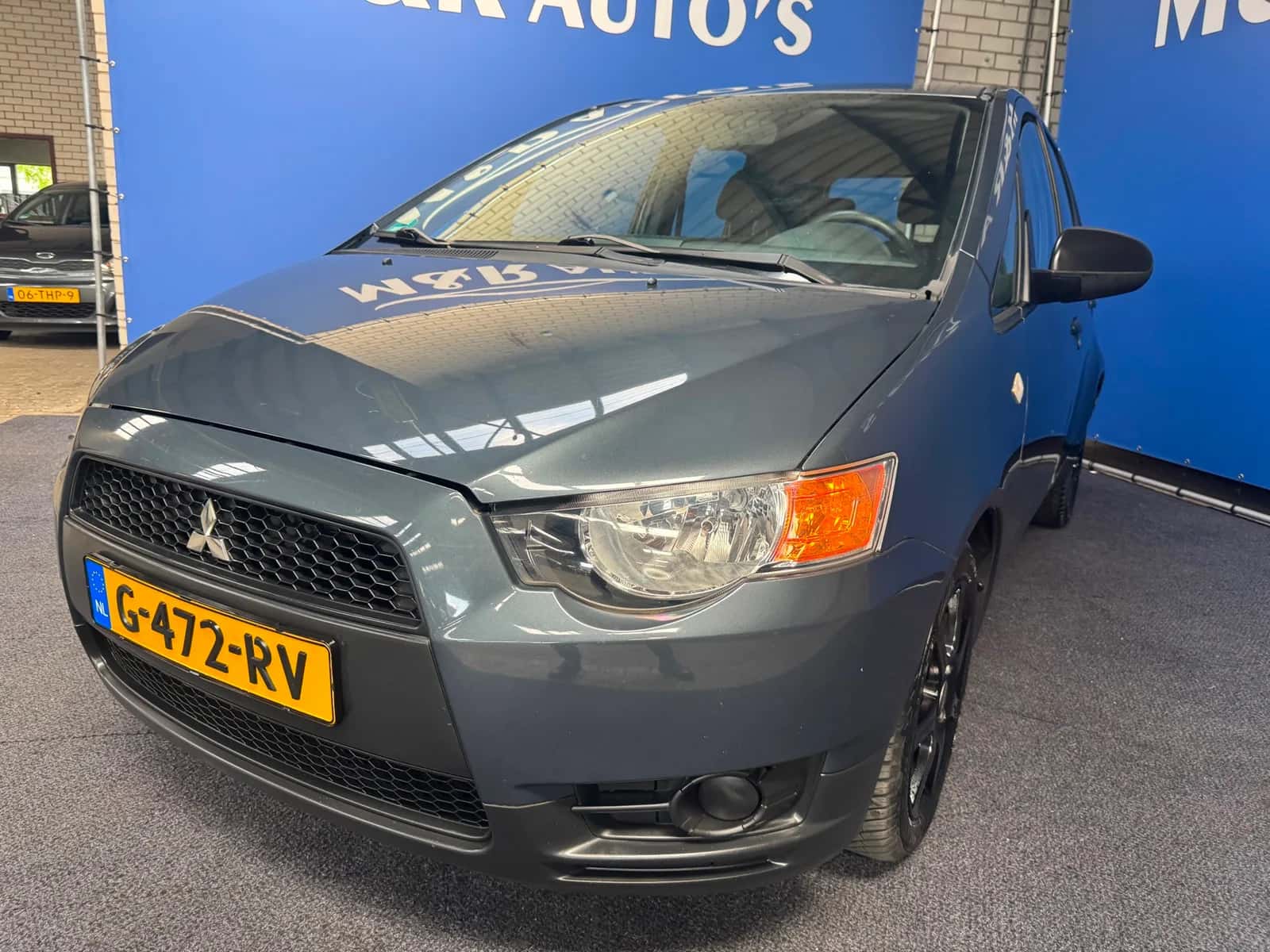 Mitsubishi Colt (2009) — foto 1
