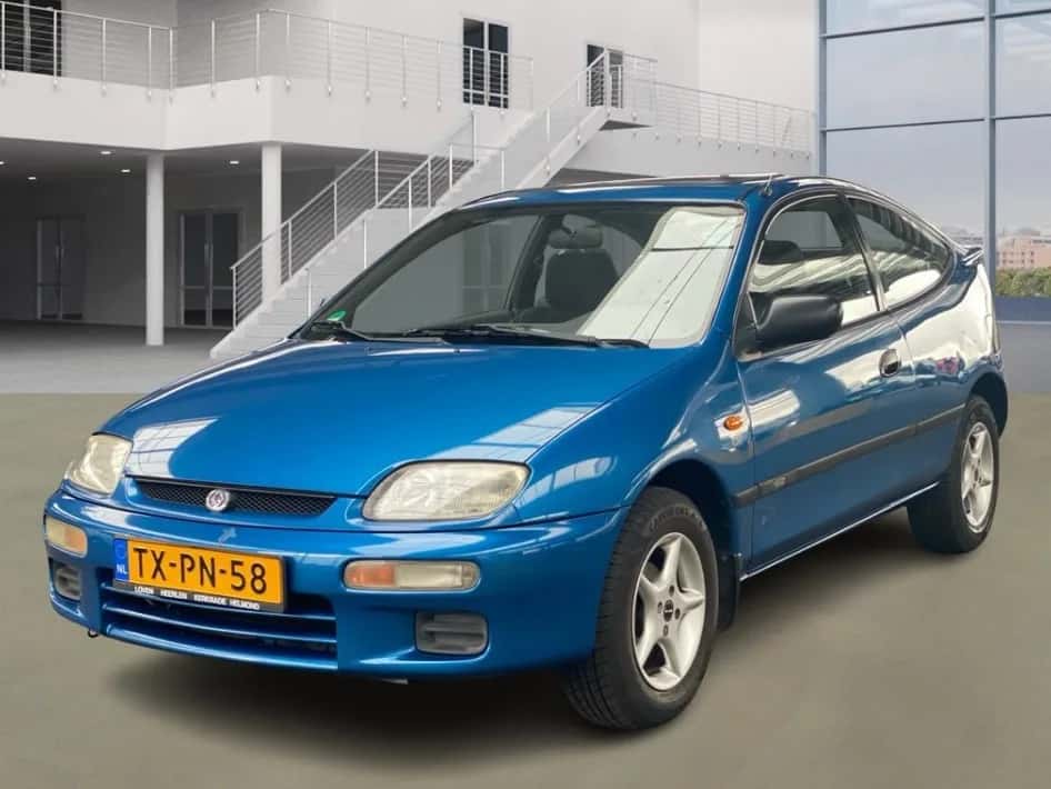 Mazda 323 (1998) — foto 1