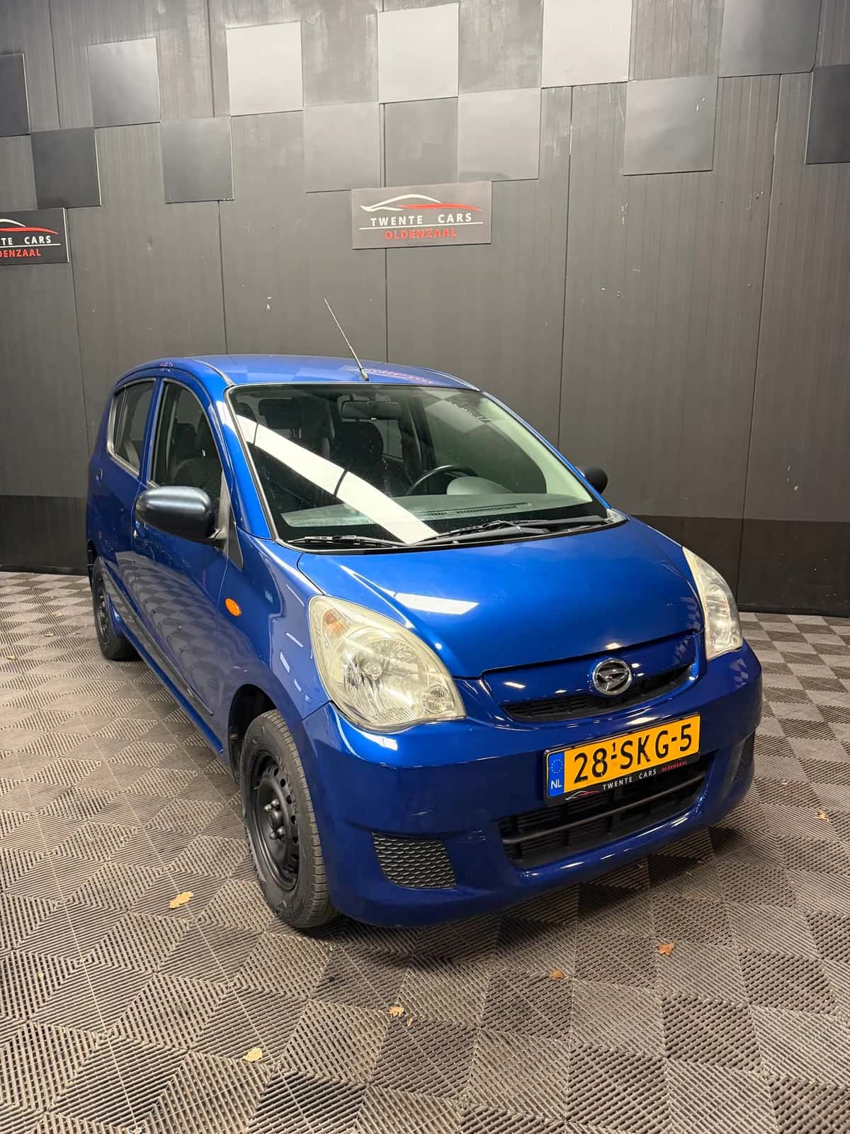 Daihatsu Cuore (2008) — foto 1