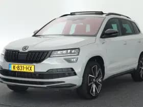 Škoda Karoq 1.5 TSI 150pk DSG ACT Sportline Business Trekhaak Camera Canton Keyless Virtual Cockpit Stoelverwarming Navigatie