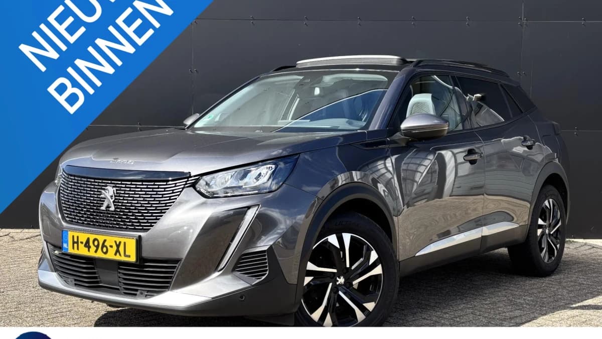 Peugeot 2008 1.2 PureTech Allure | Schuif-kanteldak | Apple-Android | Trekhaak — foto 1