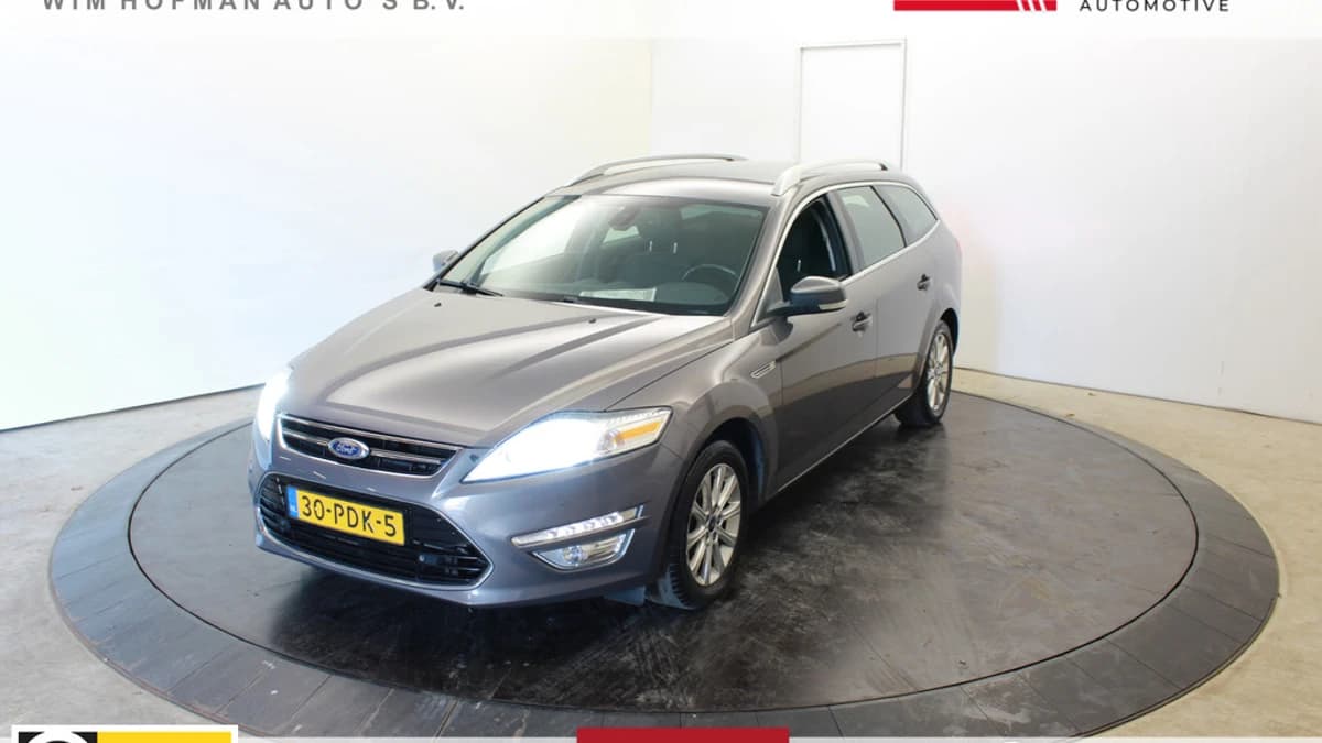 Ford Mondeo 161PK Titanium Dealer onderhouden Groot Navi incl set Nieuwe All Season — foto 1